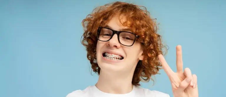 Smiling patient with traditional braces